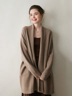 A stylish, mid-length knitted cardigan coat for women, designed with a sophisticated and elegant look perfect for autumn and winter.