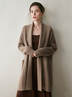A stylish, mid-length knitted cardigan coat for women, designed with a sophisticated and elegant look perfect for autumn and winter.