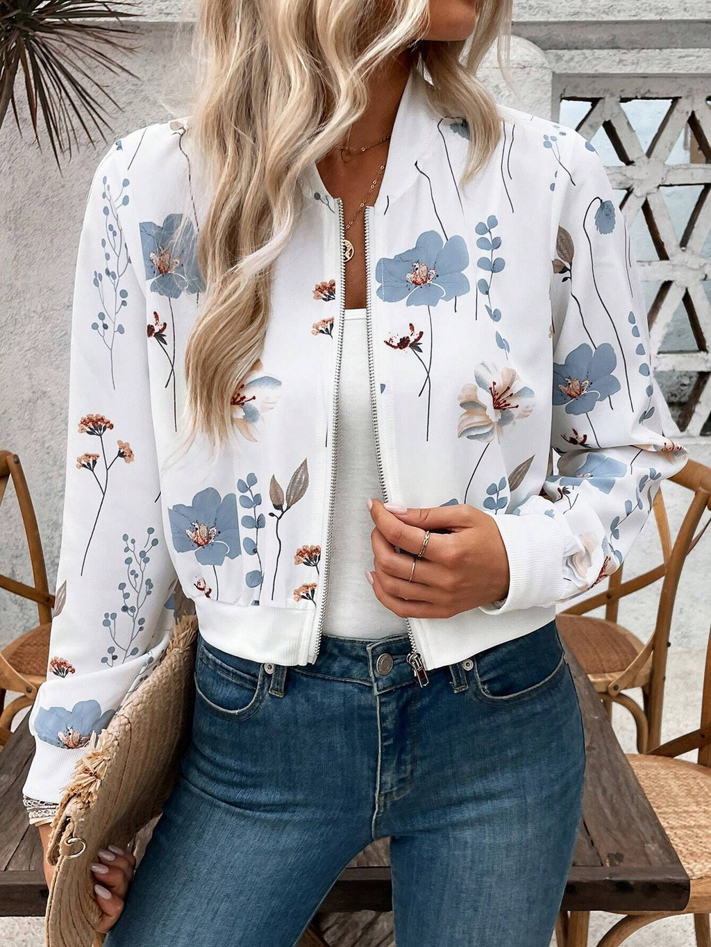 Elegant women’s short-sleeved casual jacket with floral prints and zipper closure.