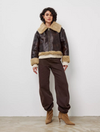 Short, autumn/winter jacket with fur-trimmed lapels and one-piece design for women