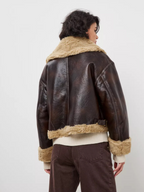 Short, autumn/winter jacket with fur-trimmed lapels and one-piece design for women