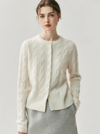 New autumn/winter version: A versatile women’s sweater in cashmere, with a round neckline, pearl buttons, and a twisted design – perfect for every occasion.