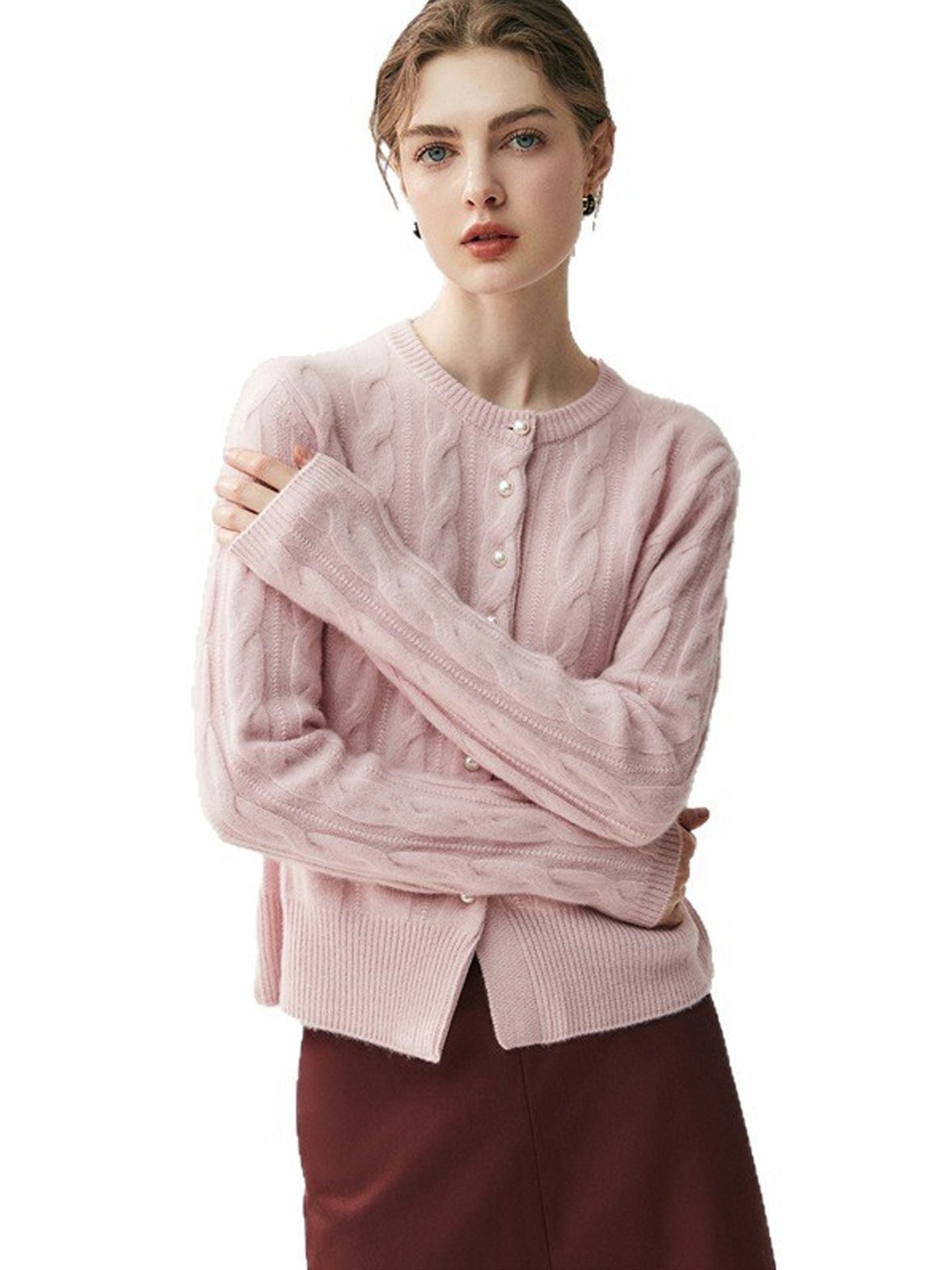 New autumn/winter version: A versatile women’s sweater in cashmere, with a round neckline, pearl buttons, and a twisted design – perfect for every occasion.