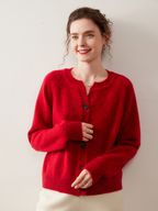 A stylish, slimming knitted sweater for women, made of cashmere-like material and featuring shoulder-cut sleeves and a round neckline.