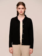 Women’s knitted long-sleeved wool sweater in a plain color – a stylish, warm, and comfortable garment.