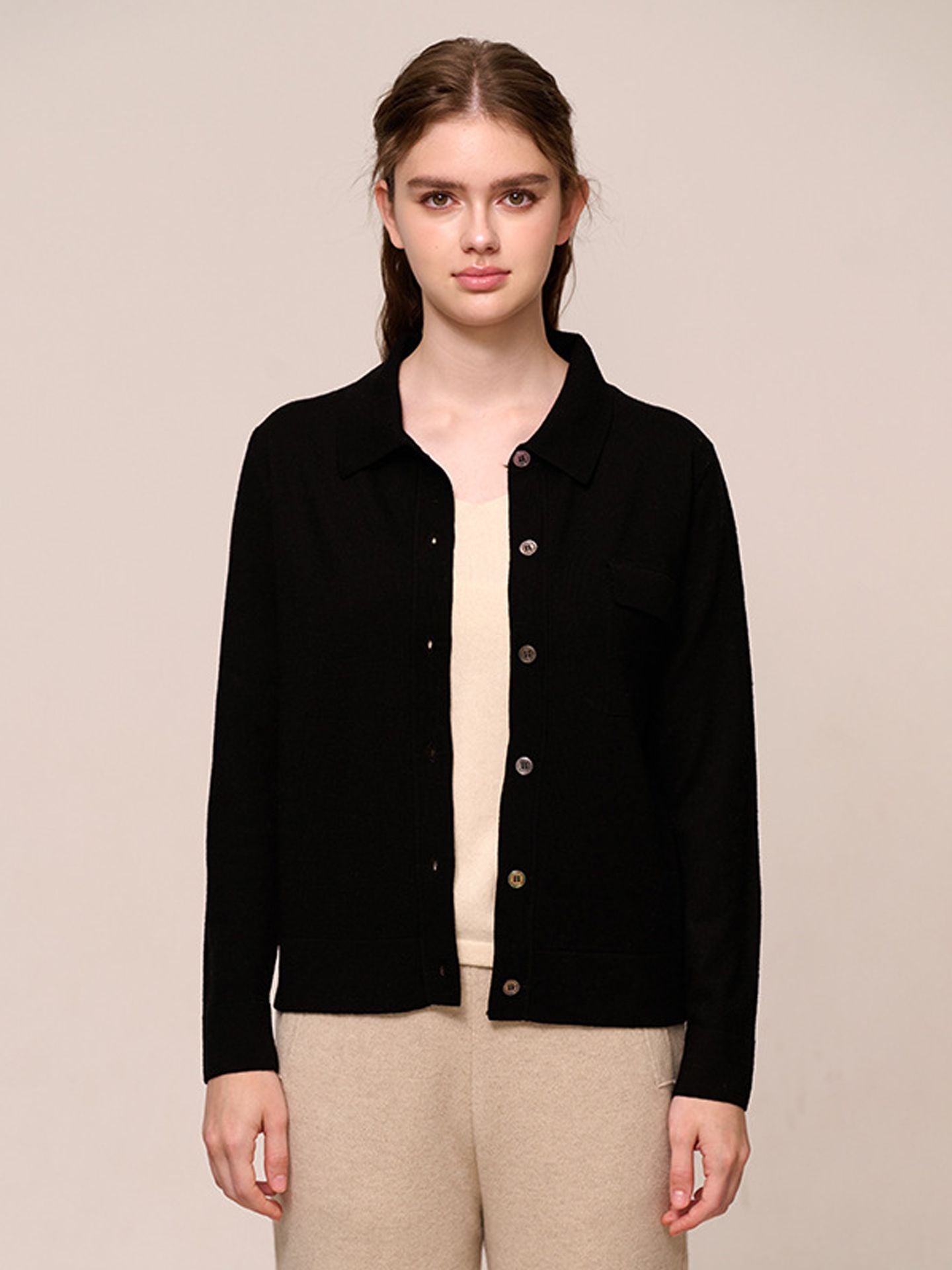Women’s knitted long-sleeved wool sweater in a plain color – a stylish, warm, and comfortable garment.