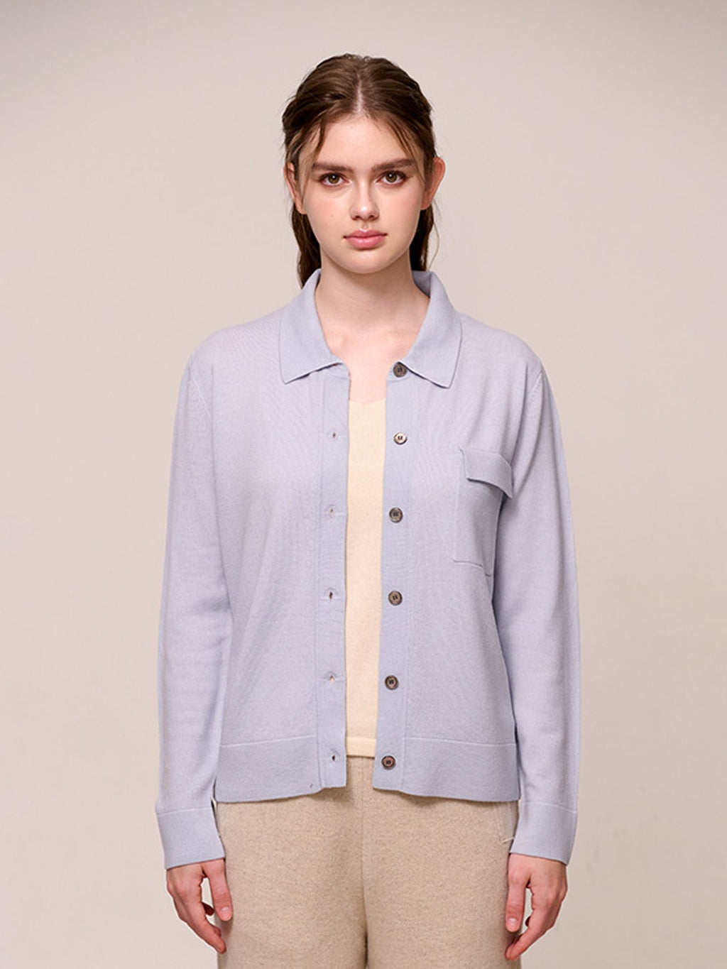 Women’s knitted long-sleeved wool sweater in a plain color – a stylish, warm, and comfortable garment.
