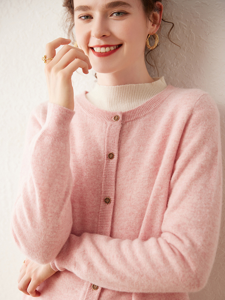 Women’s cashmere sweater with round neckline; a loose, solid-colored sweater that helps to slim the figure – a new autumn fashion item.