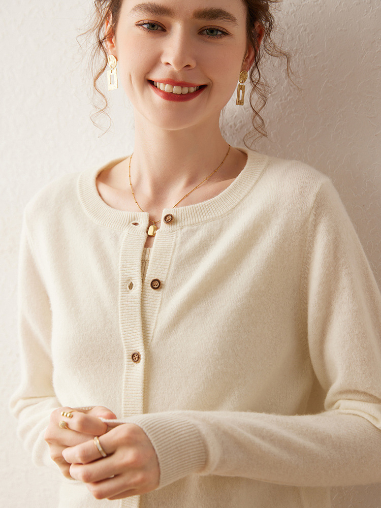 Women’s cashmere sweater with round neckline; a loose, solid-colored sweater that helps to slim the figure – a new autumn fashion item.