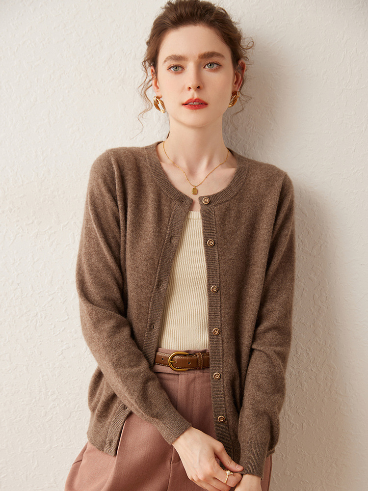 Women’s cashmere sweater with round neckline; a loose, solid-colored sweater that helps to slim the figure – a new autumn fashion item.