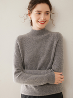 Thick, loose-fitting sweater made of pure cashmere, featuring a semi-high collar; designed to slim the figure and is extremely comfortable to wear on the skin.