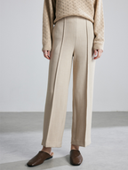 New autumn/winter style wide-leg trousers with a flattering, floor-length design. These trousers feature a milky-white color and a straight-leg design, giving them a stylish, almost suit-like look.