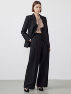 New autumn women’s trousers made of pure wool – loose fit, slimming effect, and straight cut; exude elegance and sophistication.
