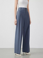 New autumn women’s trousers made of pure wool – loose fit, slimming effect, and straight cut; exude elegance and sophistication.