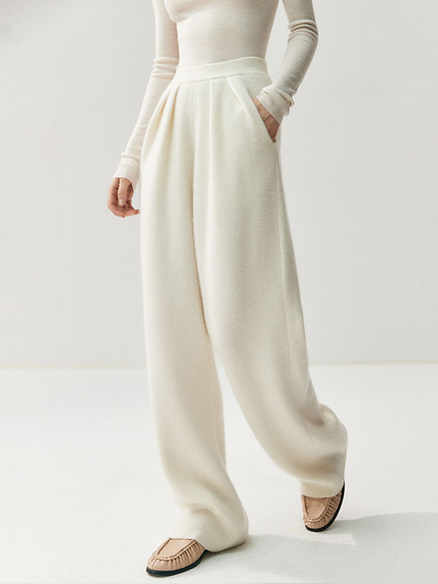 Cashmere and woolen trousers – high-waisted, straight-cut, and draping in style; designed for autumn and winter, with thickened knitted fabric.