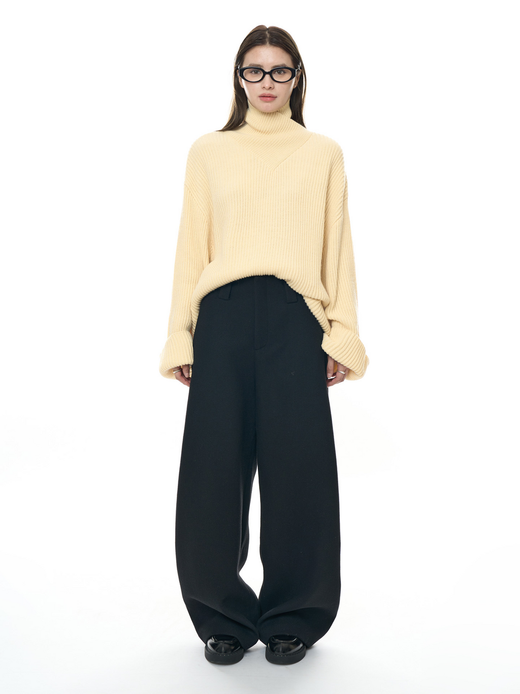 New, stylish woolen trousers with a curved cut – thick, warm, and featuring a relaxed, loose fit, perfect for women.