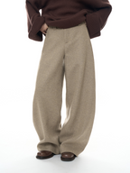 New, stylish woolen trousers with a curved cut – thick, warm, and featuring a relaxed, loose fit, perfect for women.
