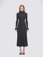 Elegant and graceful gray sweater dress with high collar, long sleeves, and a knitted woolen underlayer, perfect for autumn and winter.