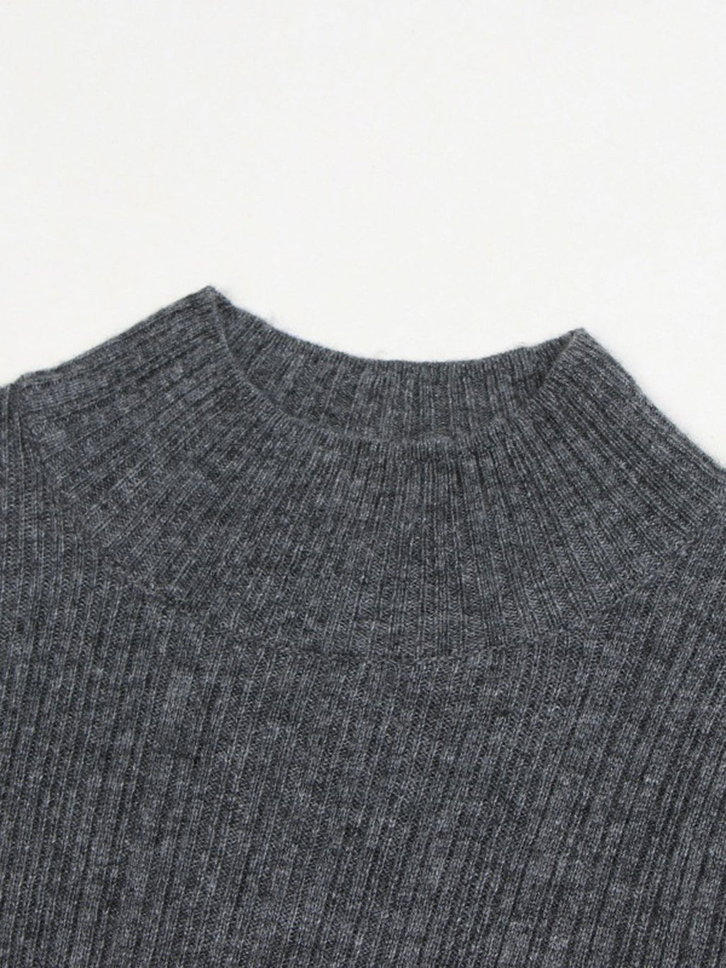 Elegant and graceful gray sweater dress with high collar, long sleeves, and a knitted woolen underlayer, perfect for autumn and winter.