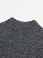 Elegant and graceful gray sweater dress with high collar, long sleeves, and a knitted woolen underlayer, perfect for autumn and winter.
