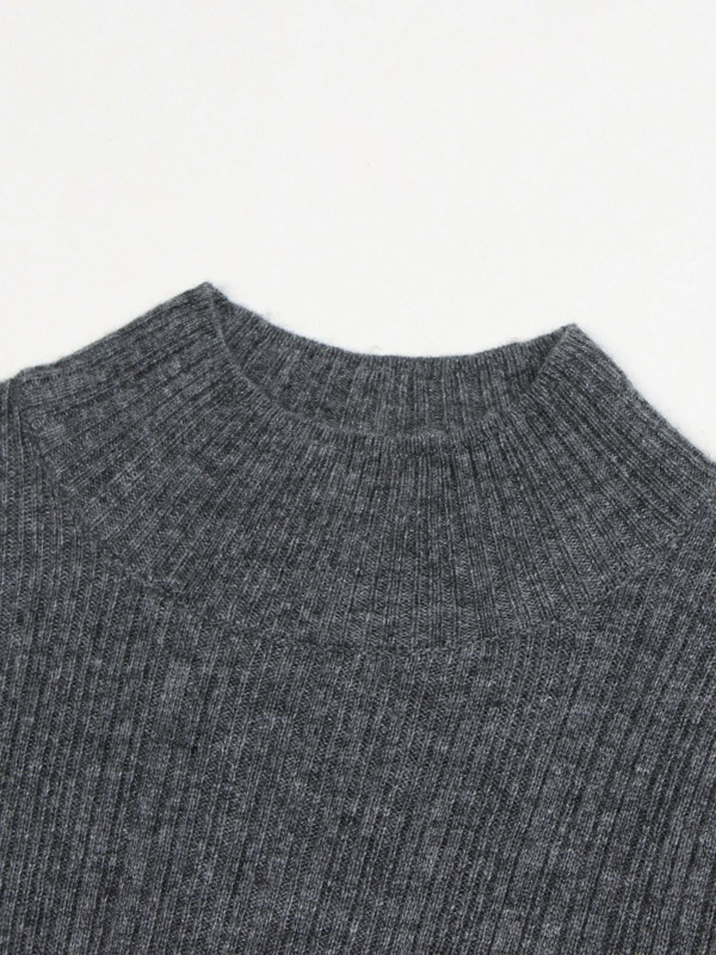 Elegant and graceful gray sweater dress with high collar, long sleeves, and a knitted woolen underlayer, perfect for autumn and winter.