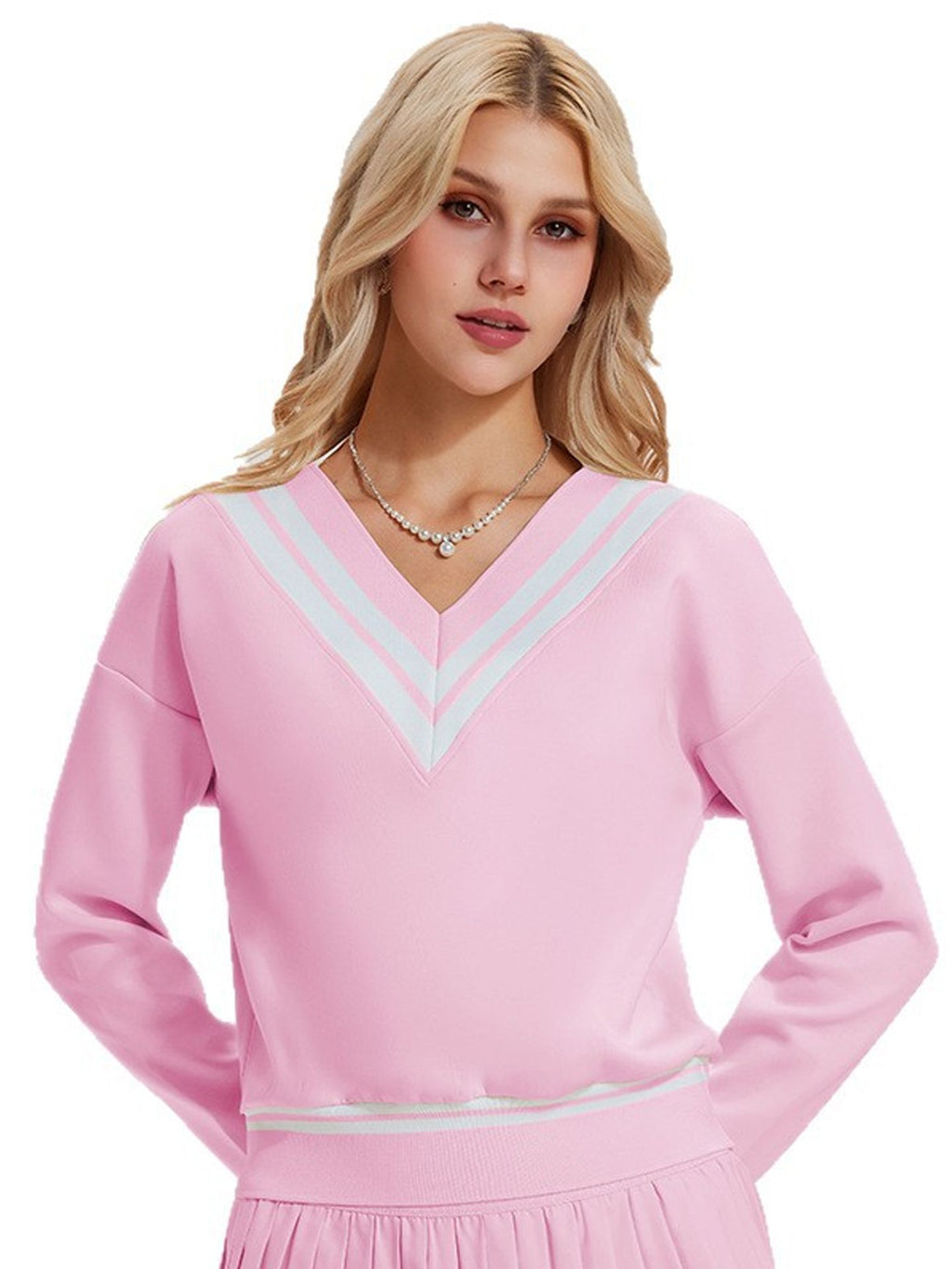 Long-sleeved sports top for women, designed for tennis play. Features a large V-neck and a stylish, casual design.