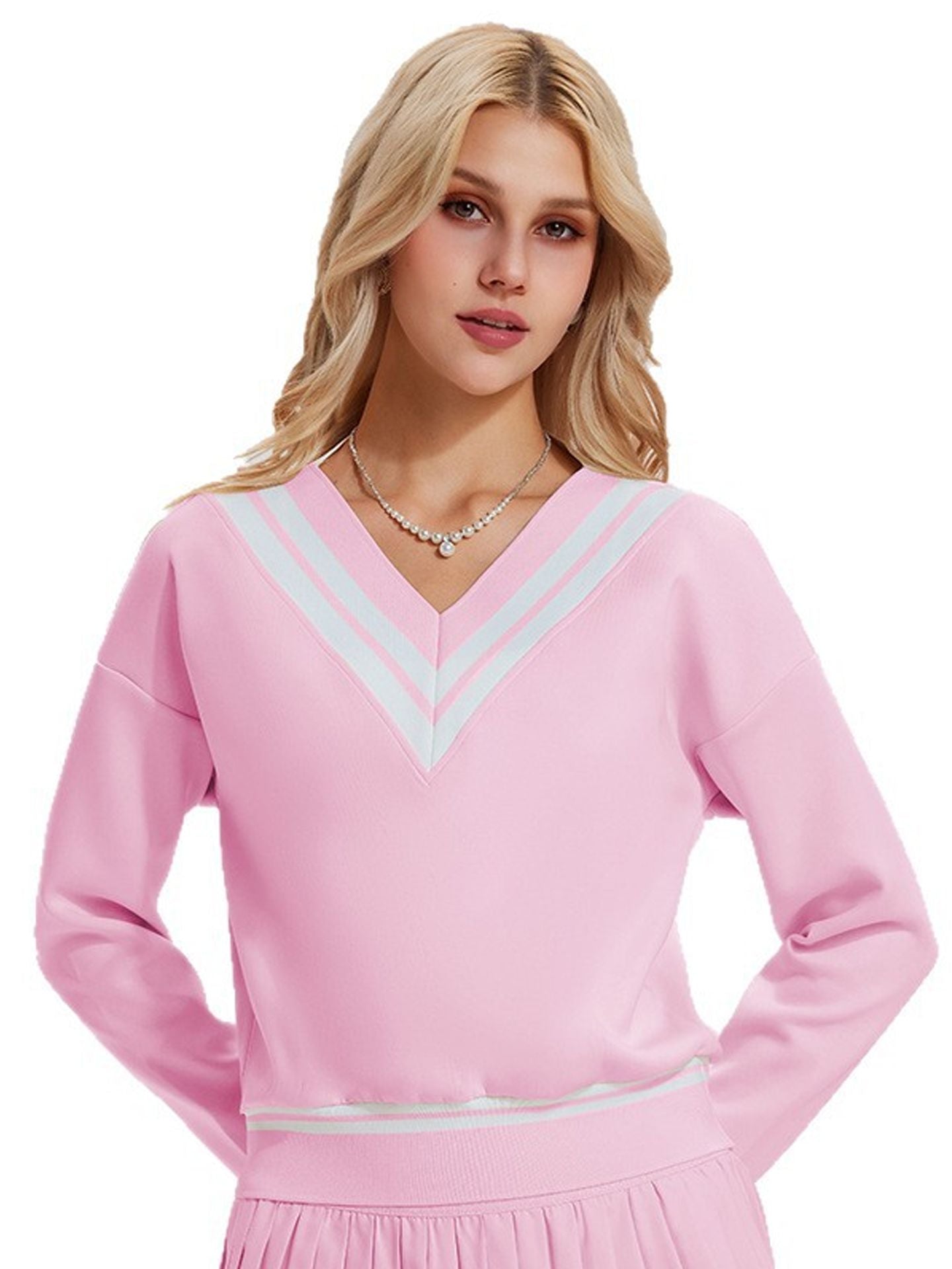 Long-sleeved sports top for women, designed for tennis play. Features a large V-neck and a stylish, casual design.