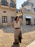 A stylish and fashionable outfit for women: a fake two-piece hoodie paired with a skirt.