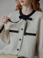 Soft, delicate bow-patterned sweater – a perfect winter outfit for girls with a gentle, soft-looking style.