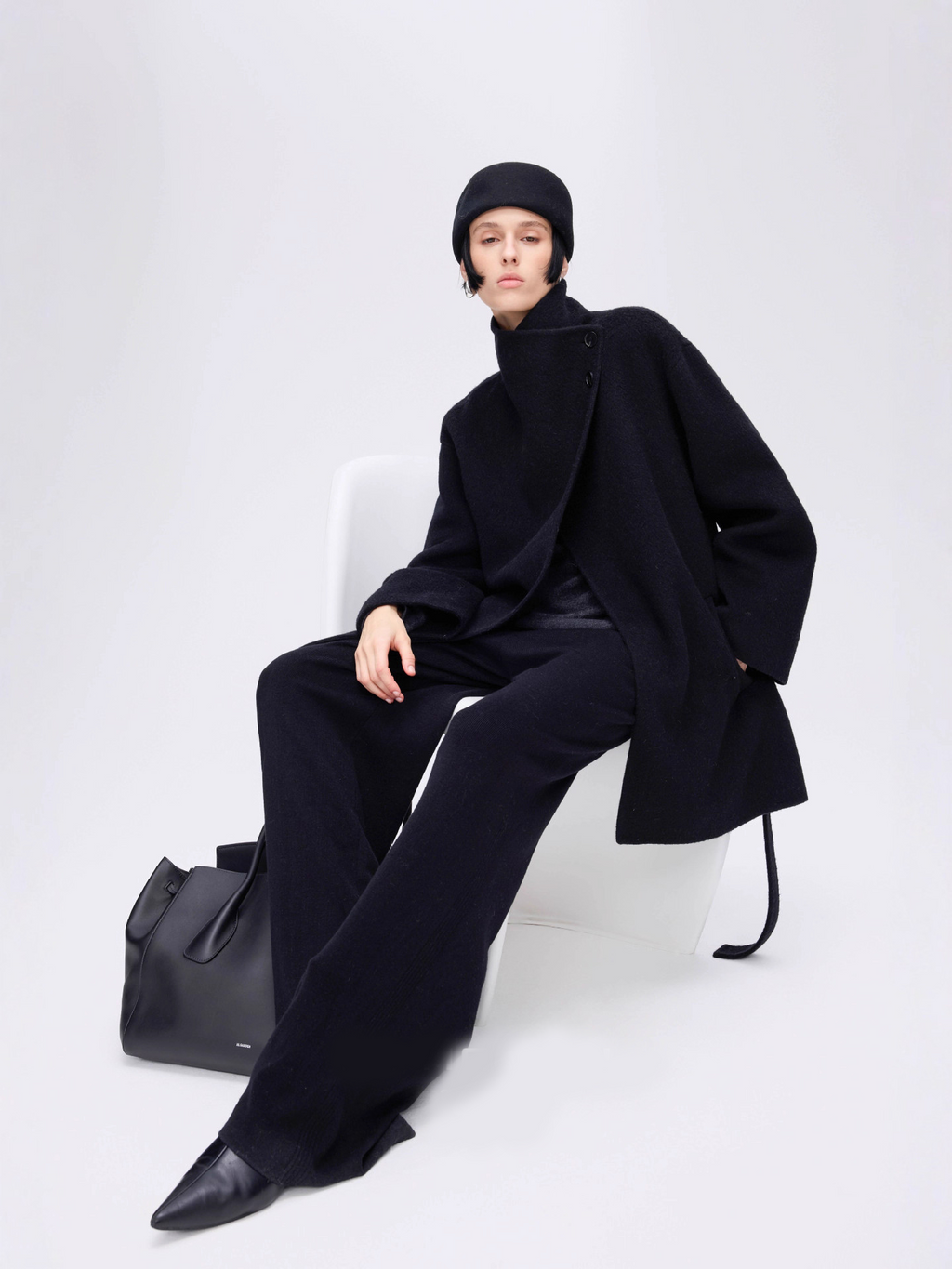 New winter arrival: Asymmetrical stand-up collar mid-length wool coat with a slanted placket.