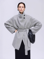 New winter arrival: Asymmetrical stand-up collar mid-length wool coat with a slanted placket.