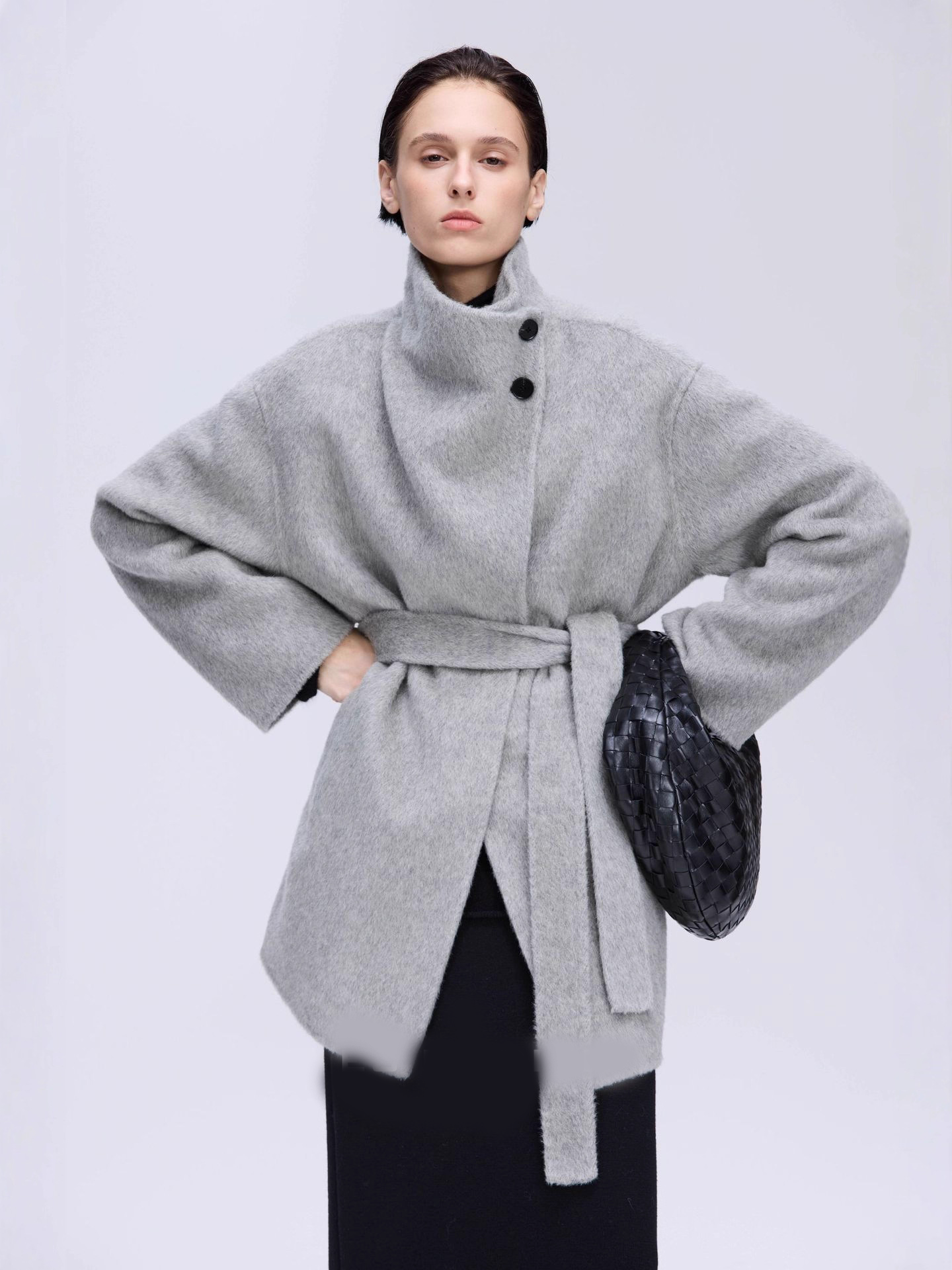 New winter arrival: Asymmetrical stand-up collar mid-length wool coat with a slanted placket.