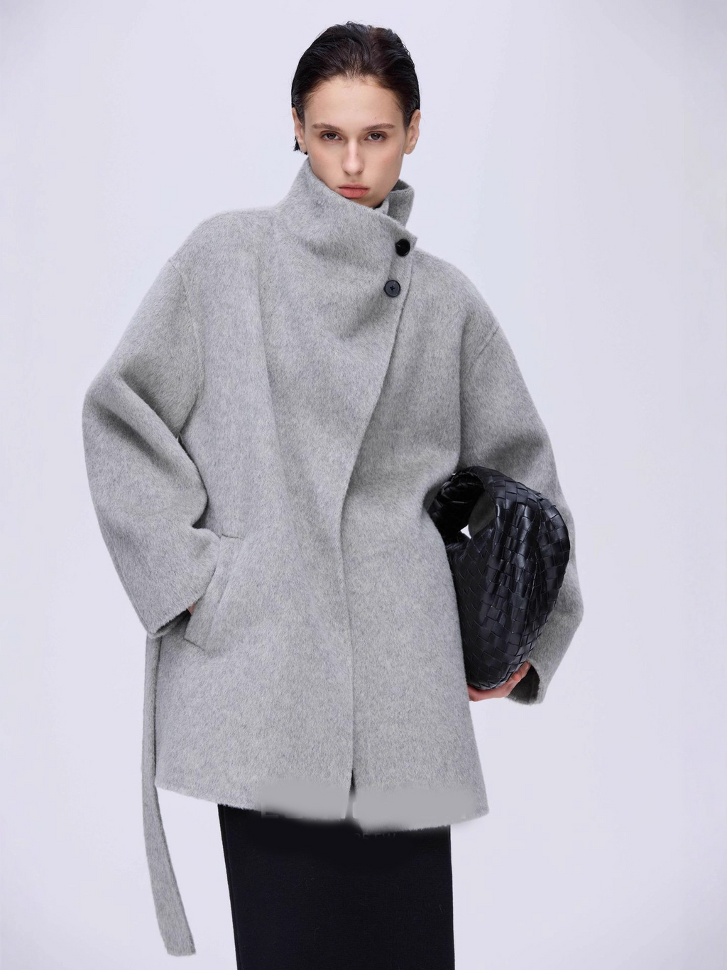 New winter arrival: Asymmetrical stand-up collar mid-length wool coat with a slanted placket.
